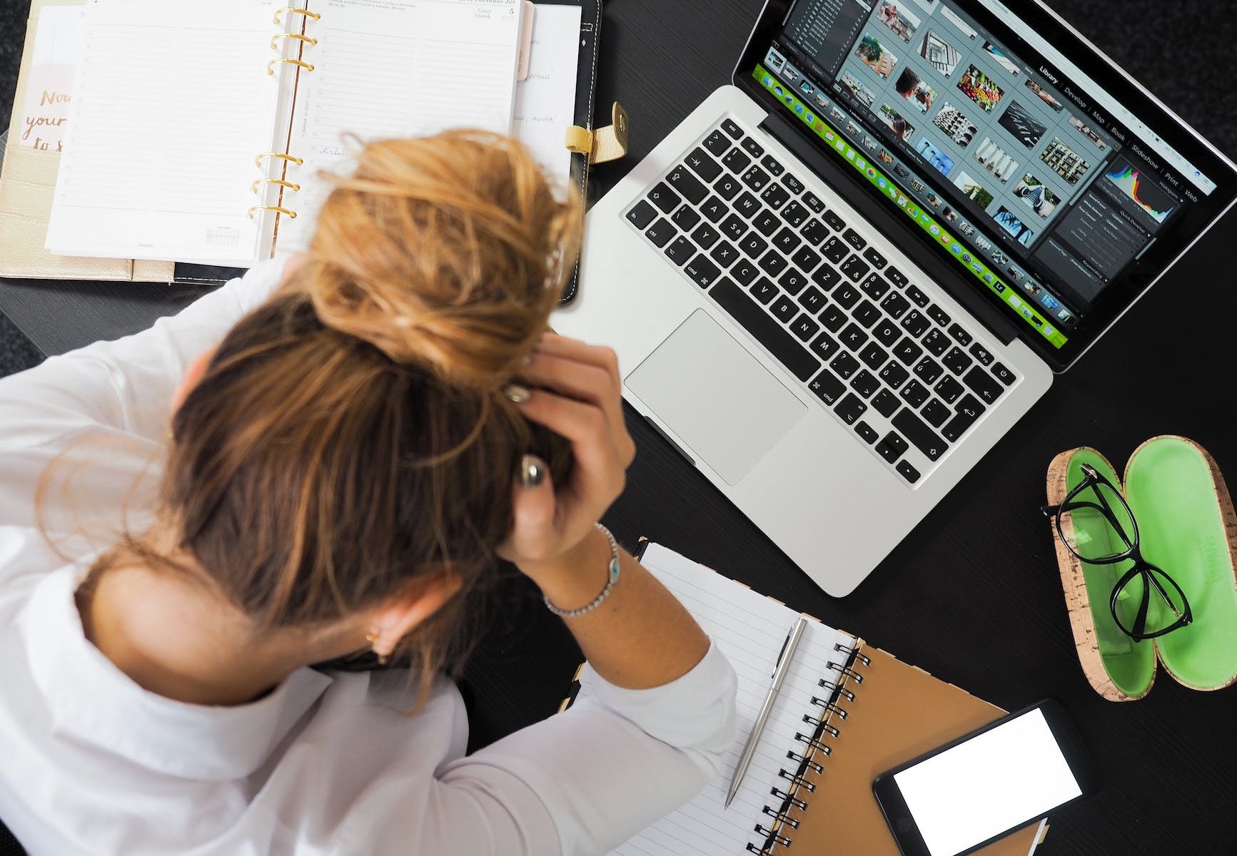 woman sitting in front of macbook